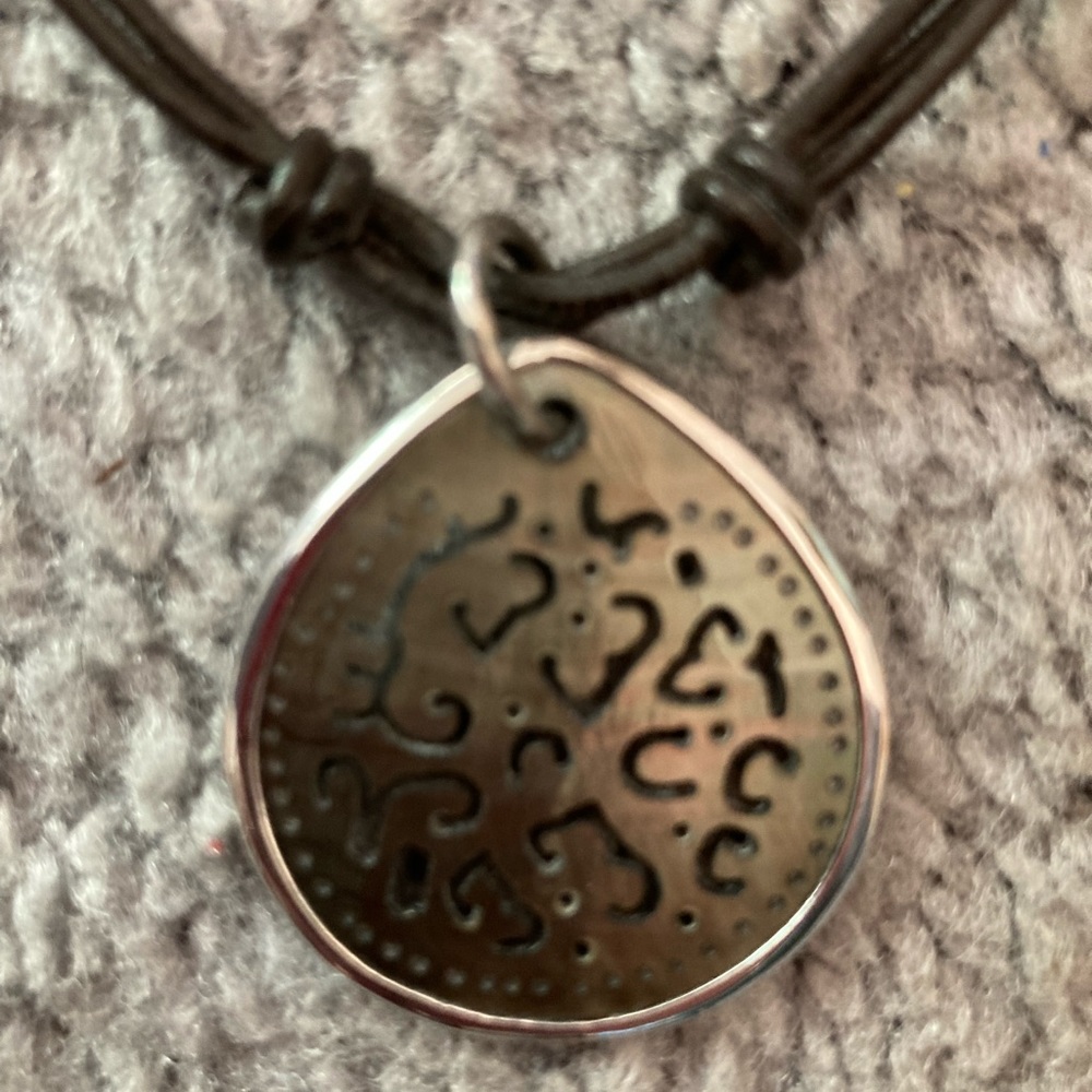 Retired Silpada Sterling Silver carved lip shell leather corded necklace